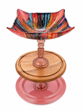 The Pricilla tiered serving tray with hand-painted resin drip art bowl, blush pink faceted glass stem, wood middle tier, and pink ceramic base